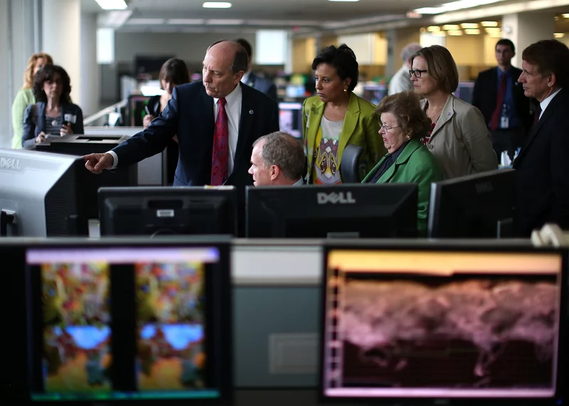 NWS Director Louis Uccelini gives a tour of NOAA's Center for Weather and Climate Prediction