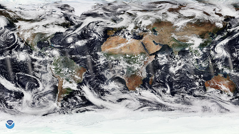 Composite satellite imagery of entire Earth showing multiple tropical cyclones in progress.