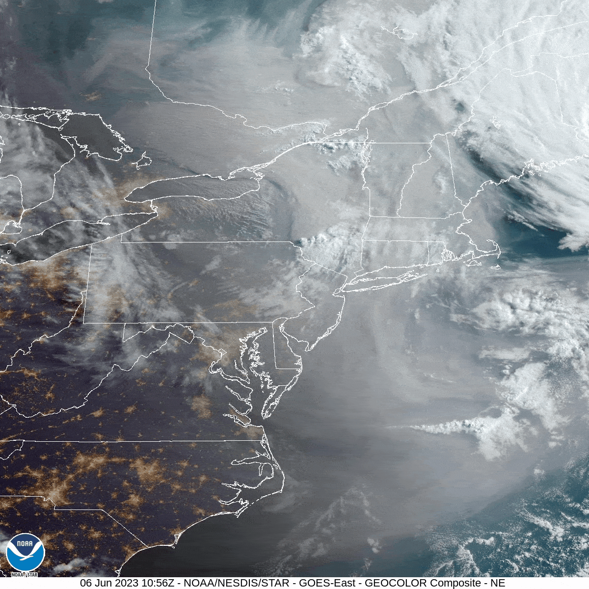 In stark contrast to the white clouds, thick grayish smoke can be seen moving over the eastern U.S. via NOAA’s GOES-16 (GOES East) satellite on June 6, 2023