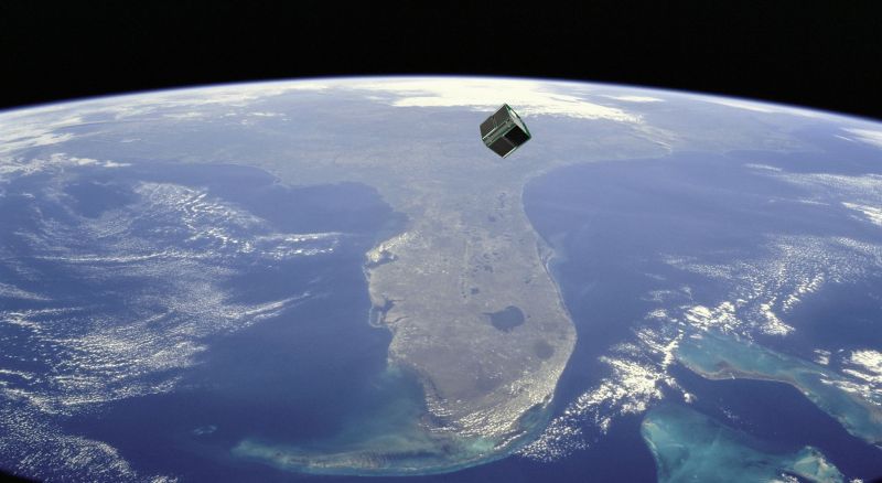 Small satellite above Earth.