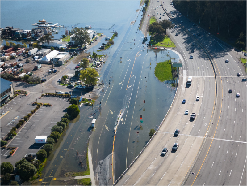 An unusually high tide, called a King Tide, floods a highway on-ramp in Northern California in January 2023. Sea level rise and El Niños can exacerbate this type of flooding.