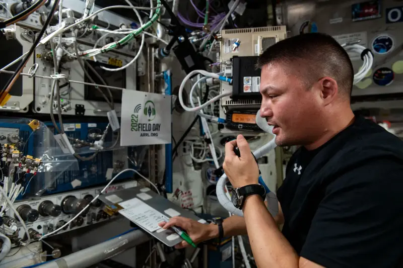 NASA astronaut Kjell Lindgren talks on the space station’s ham radio set. 